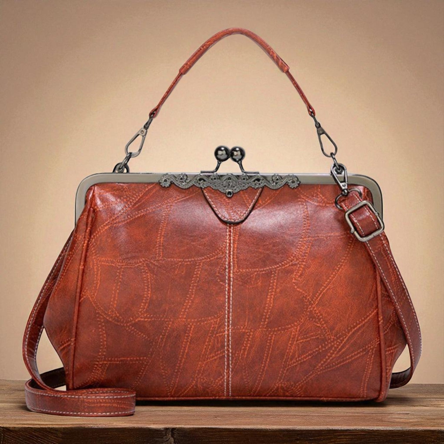 Diana · Borsa a mano con chiusura a scatto