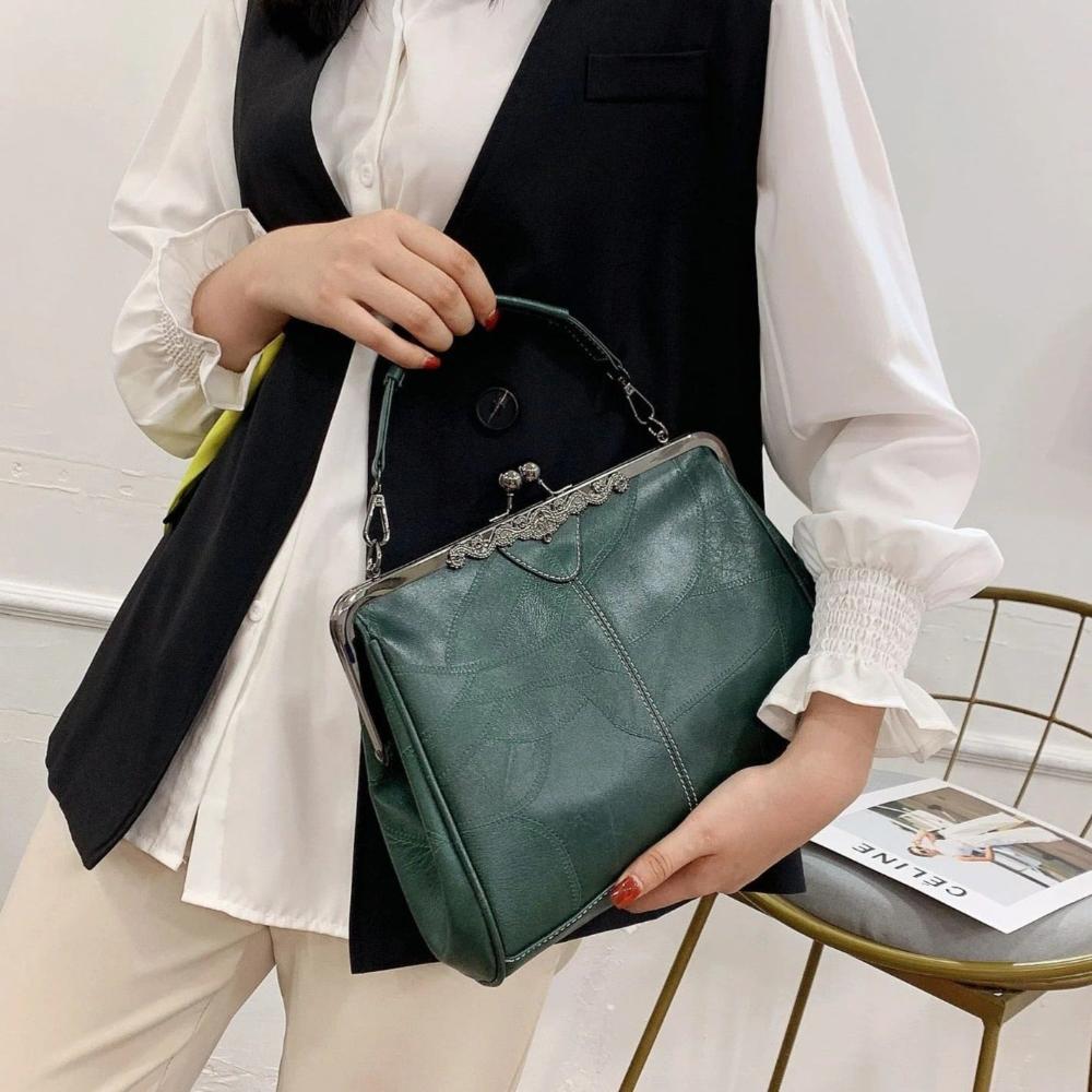 Diana · Borsa a mano con chiusura a scatto
